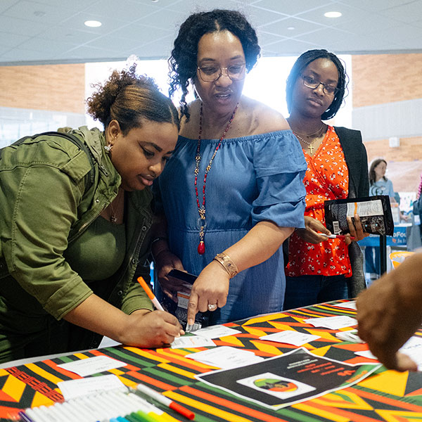 Students signing up for activity