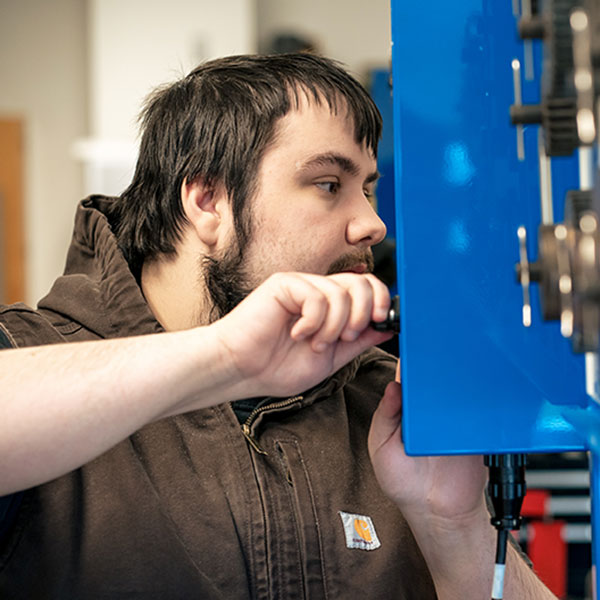 Student working on electrical equipment