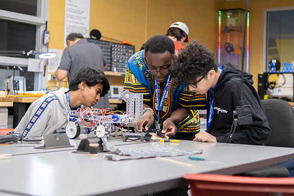 Students and teacher working in Baxter Innovation Lab