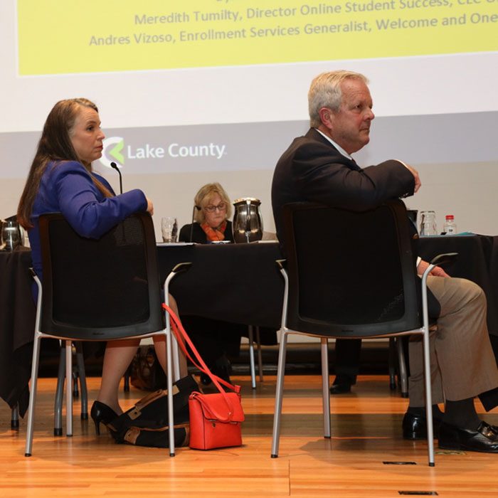 Board of Trustees participating in a monthly board meeting