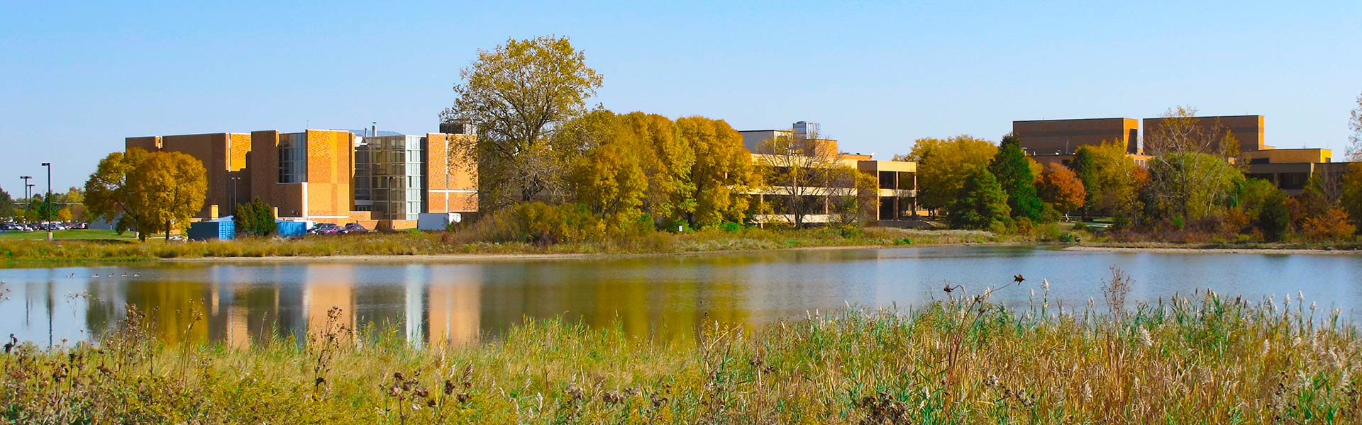Grayslake Campus as seen across Willow Lake in spring.