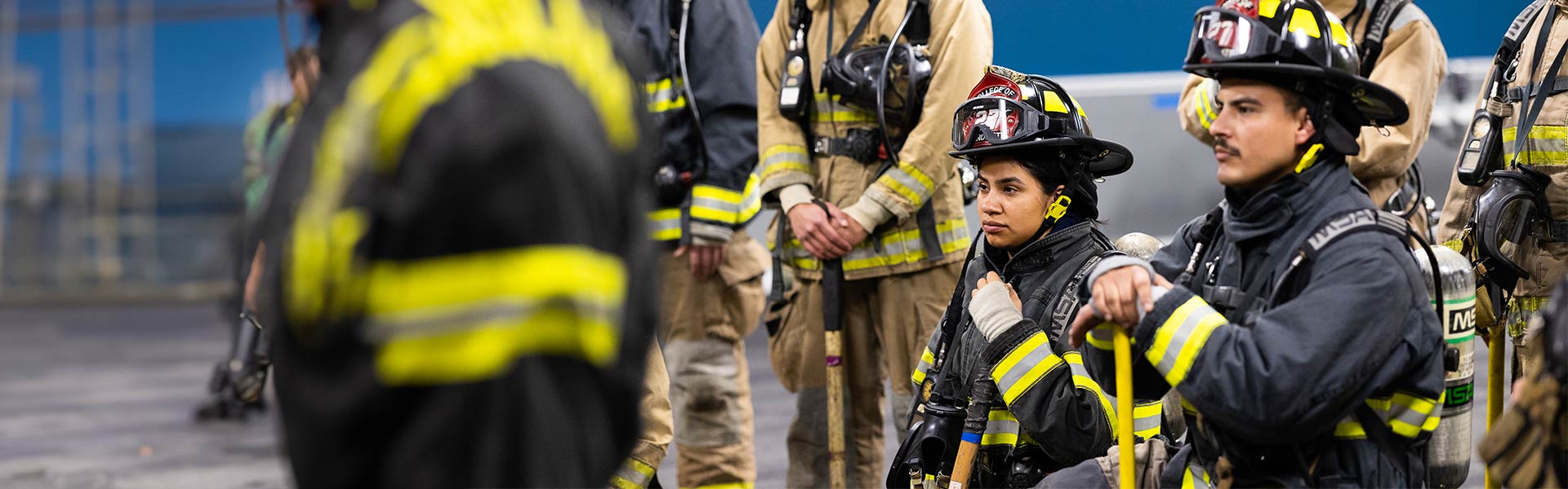 Firefighters listening to an instruction