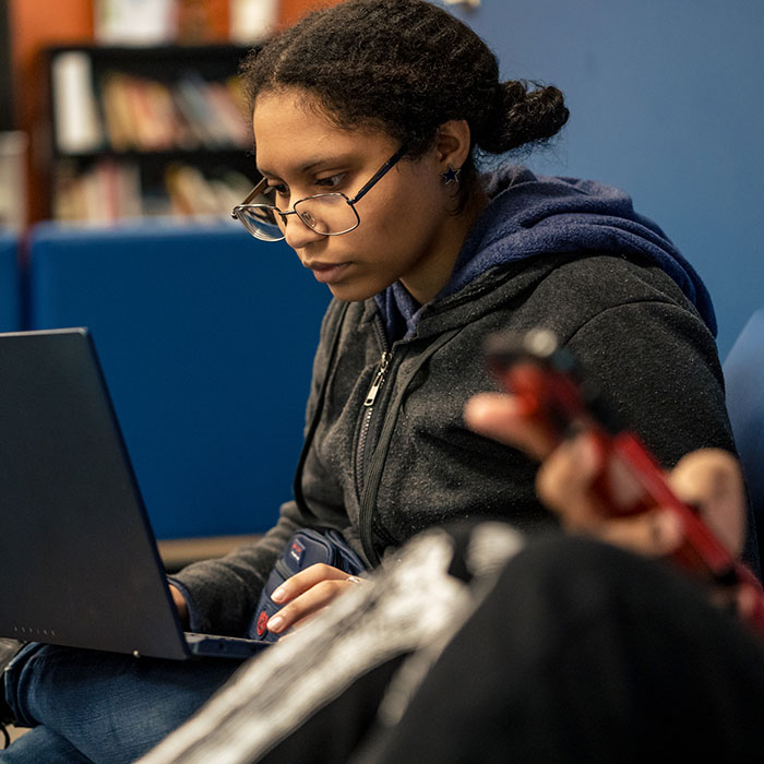 Female student working on laptop