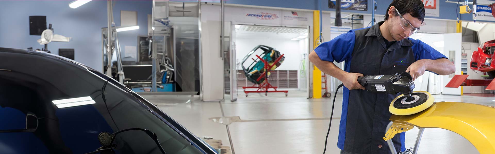 Student buffing a car part