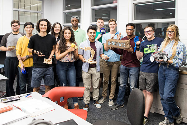 Students posing for photo in Baxter Innovation Lab