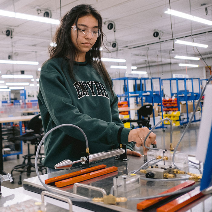 Female student working in the Industrial Technology Lab at the ATC.