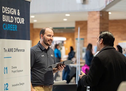 Student and company representative at job fair