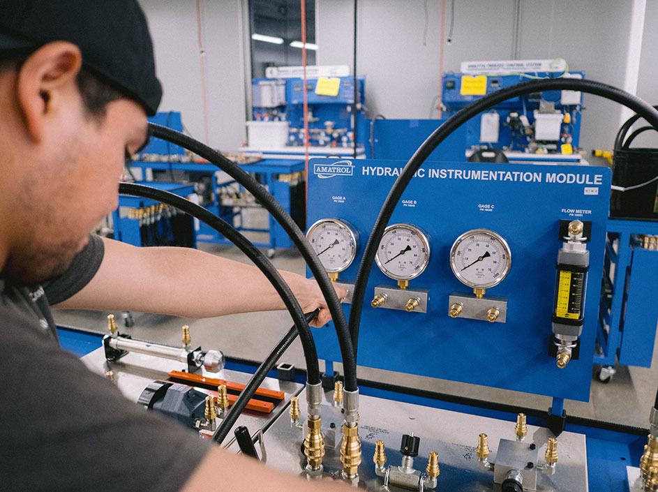 Student working on hydraulic instrumentation module.