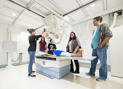 Open house attendees touring the medical imaging lab