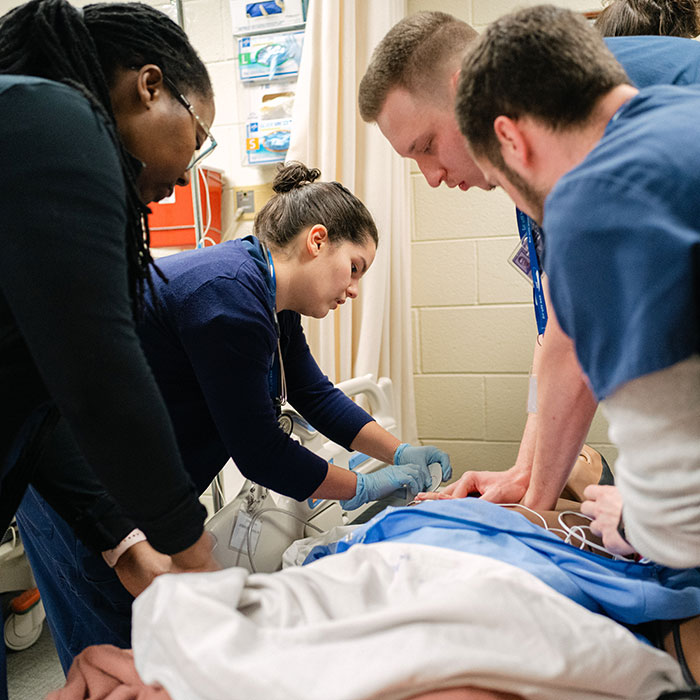 Nursing students practice skills in the simulation lab