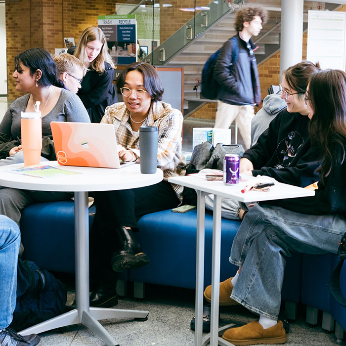 Smiling students socializing between class.