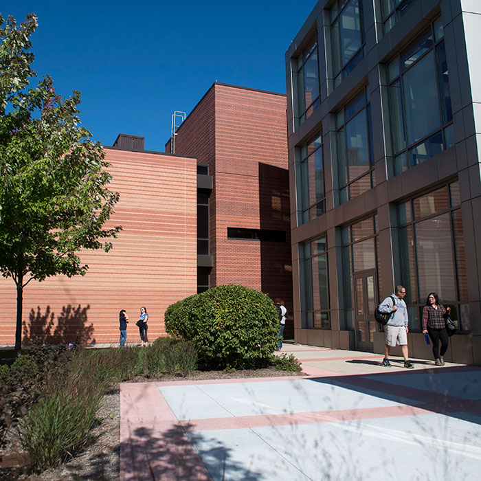 An exterior view of the Southlake Campus with students walking to and from buildings.