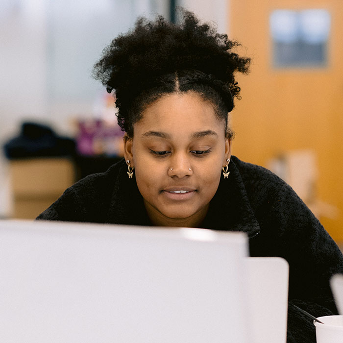 Female student taking a test at a computer