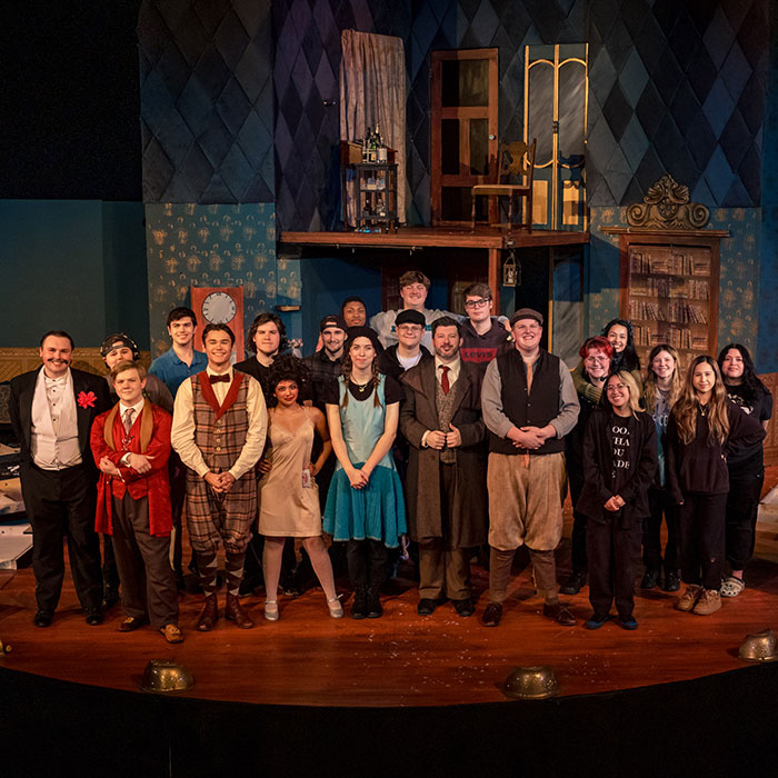 Actors on stage doing a curtain call after a performance