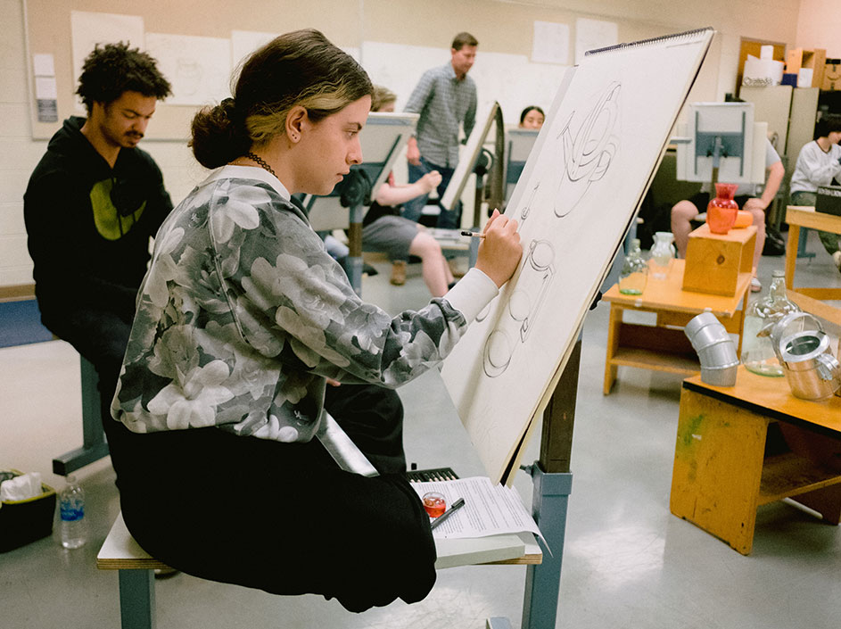 Students at easels in drawing class