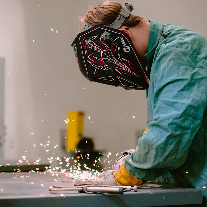 A student practices welding skills at the ATC.