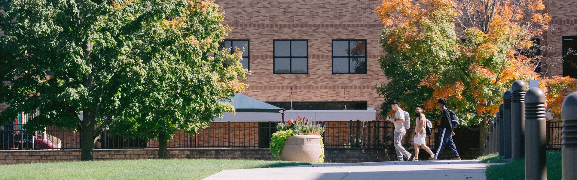 Three students walking outdoor on CLC's Grayslake Campus