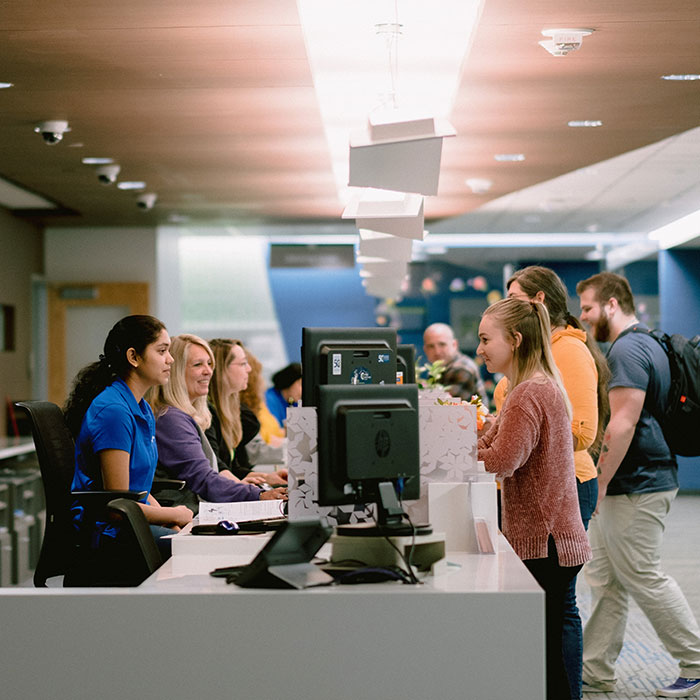 Students getting help at the Welcome and One Stop Center